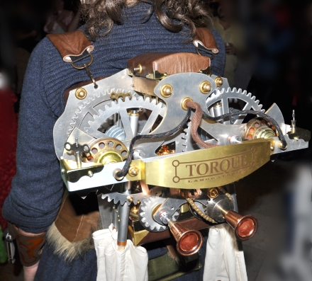 Steampunk costume by Chris Lee with waterjet cut aluminum gears which actuate a set of wings 