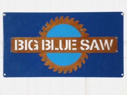 A sign in two layers, with the logo and lettering waterjet cut from wood.